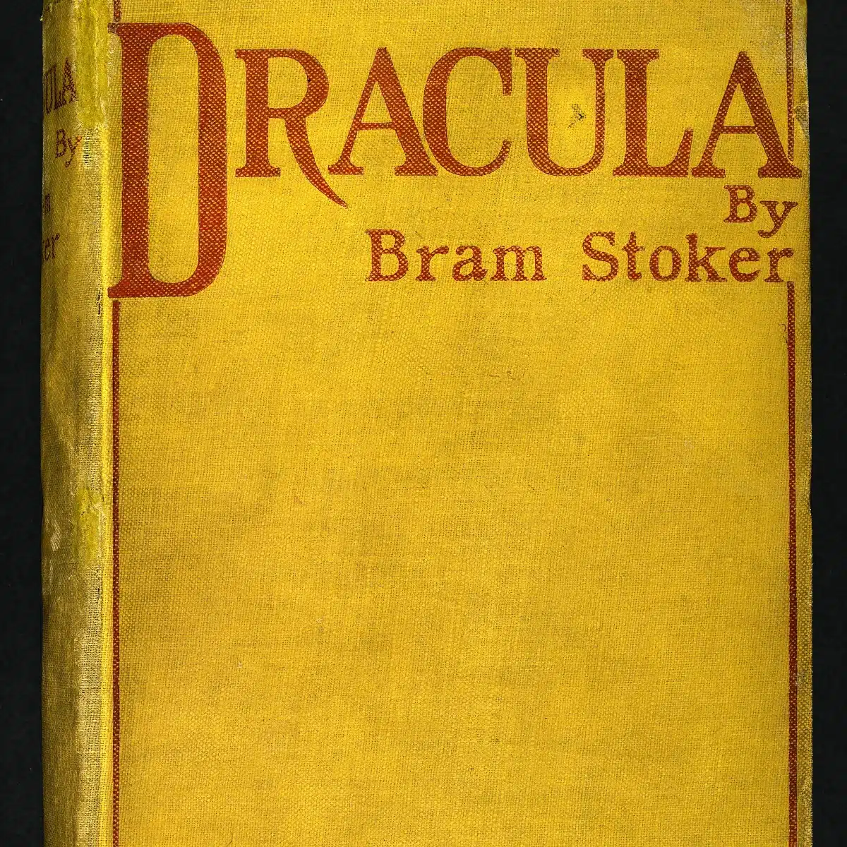Couverture jaune aux lettres rouges de la première édition du roman Dracula de Bram Stoker, publiée à Londres en mai 1897 par Archibald Constable and Company